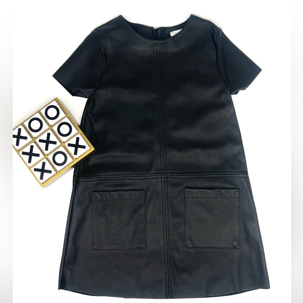 Zara Girl leather.Rounded neck. Looks amazing fits well and good material.